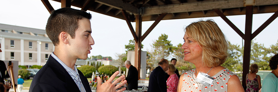 An Alumni Ambassador speaking with a prospective student