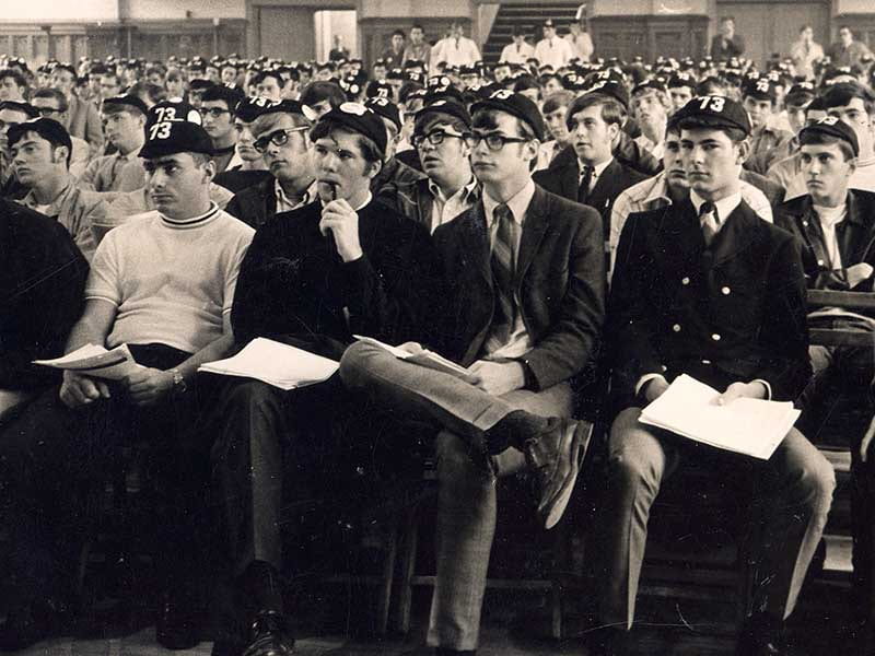 Archival photo of students listening to a lecture.