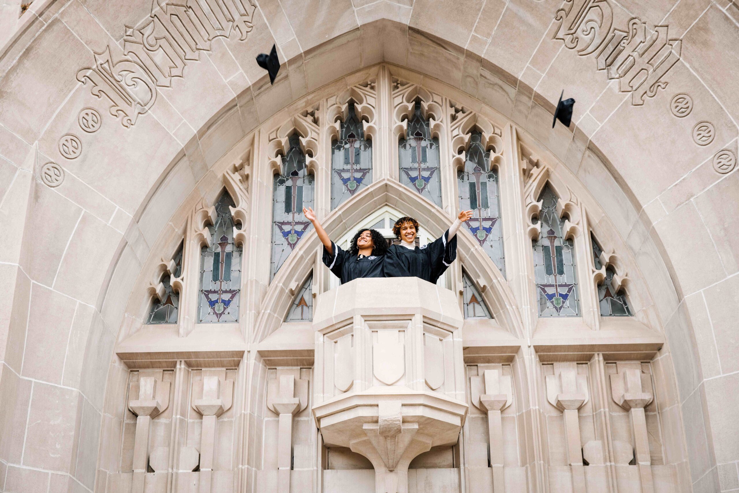 graduating students standing from Harkins balcony