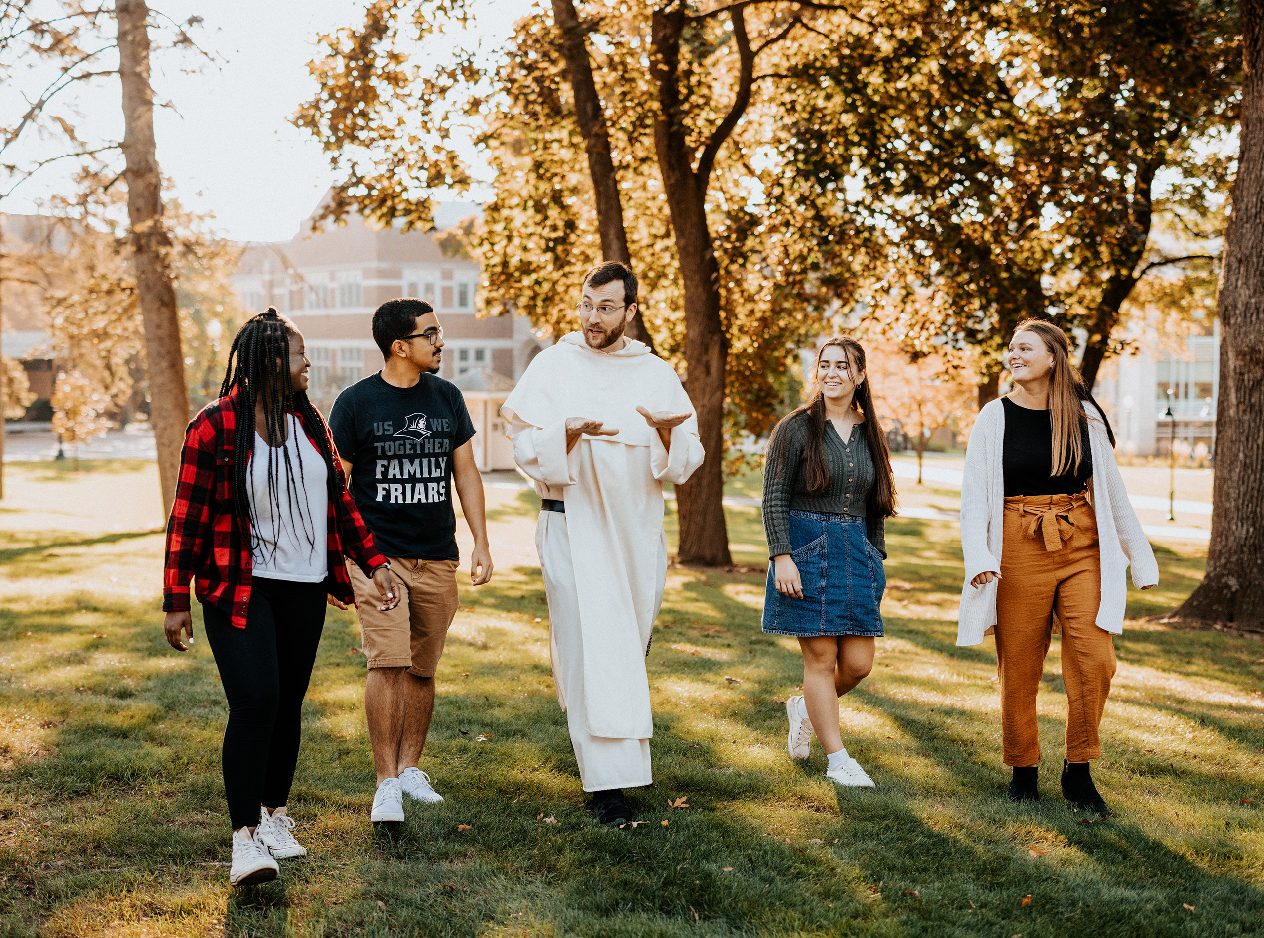 students walk with chaplain