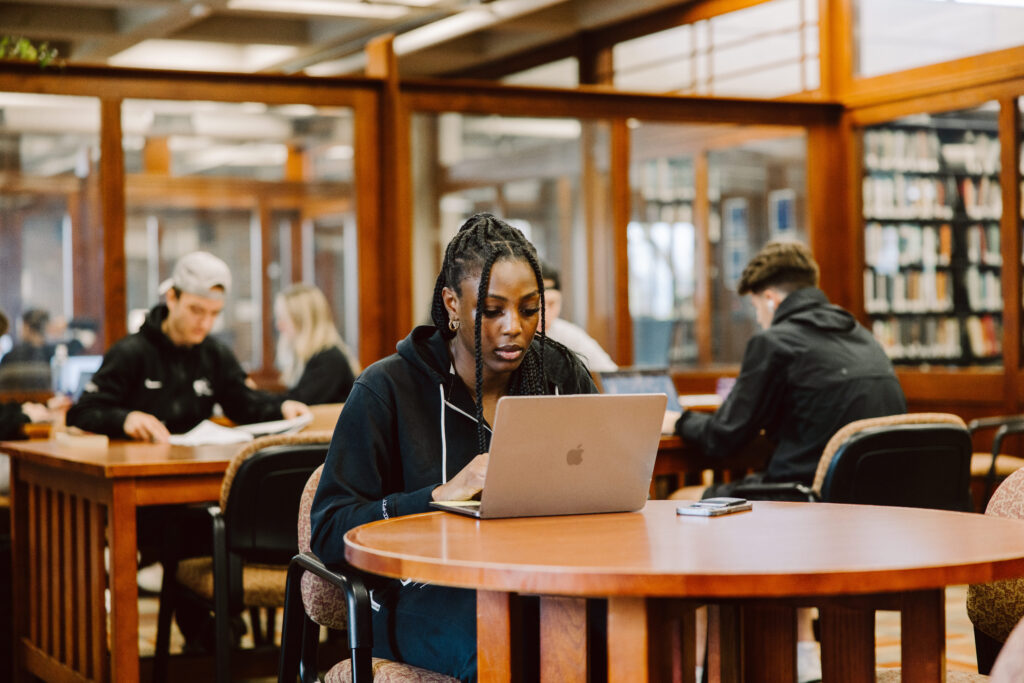 Student on a laptop in library