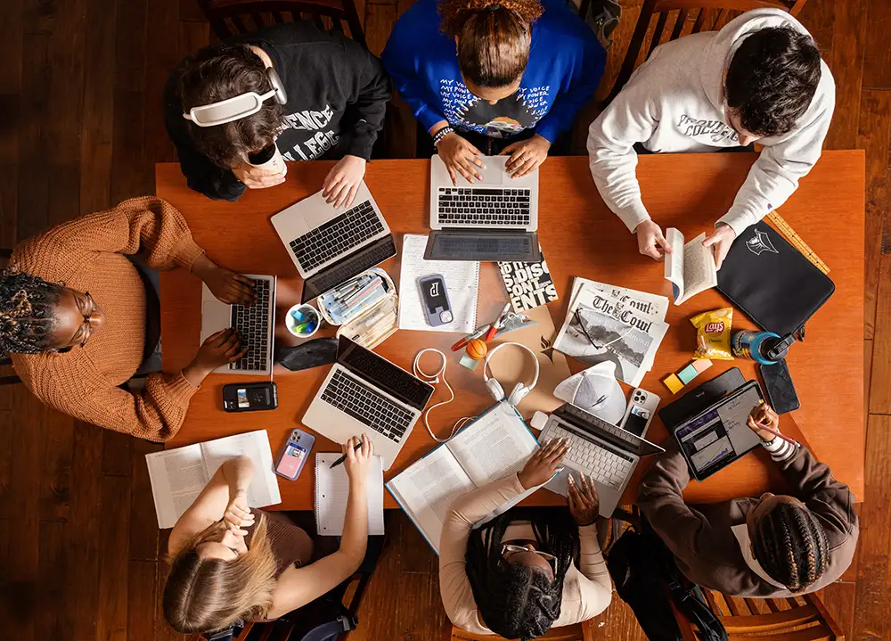 overhead shot of students studying at a table