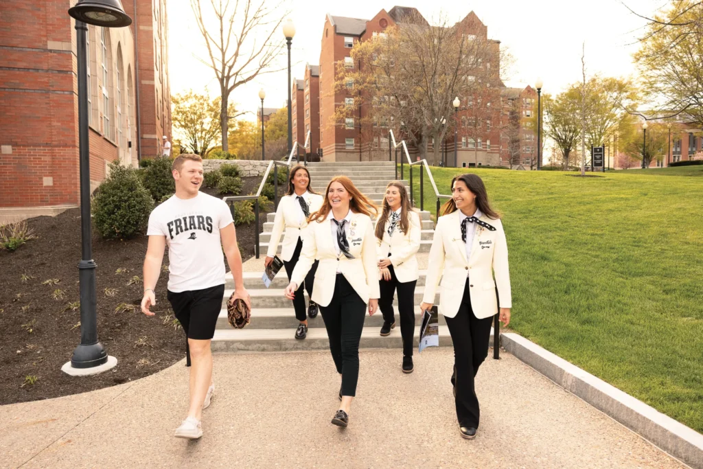 friars club students walking on campus